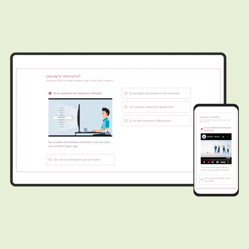 Computer monitor and smartphone displaying a website on a light green background