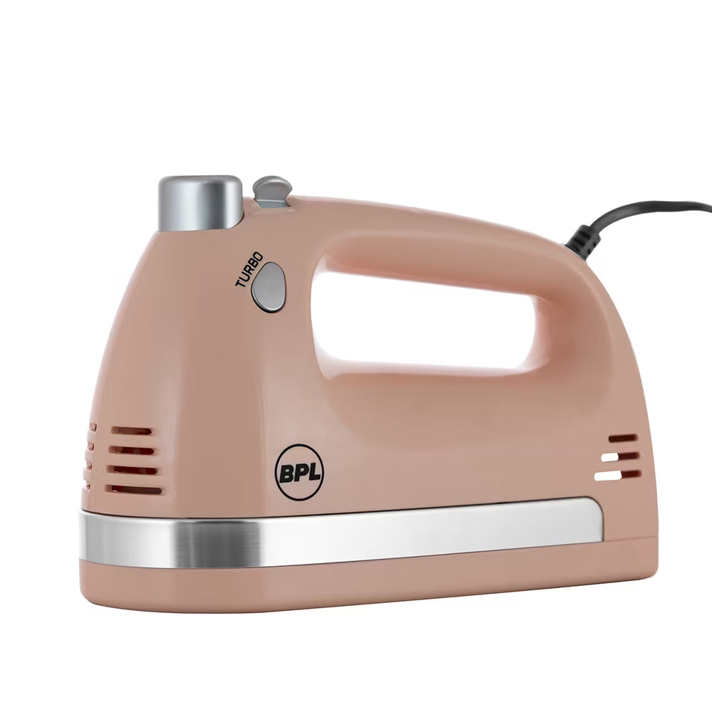 Beige hand mixer with silver accents on a white background